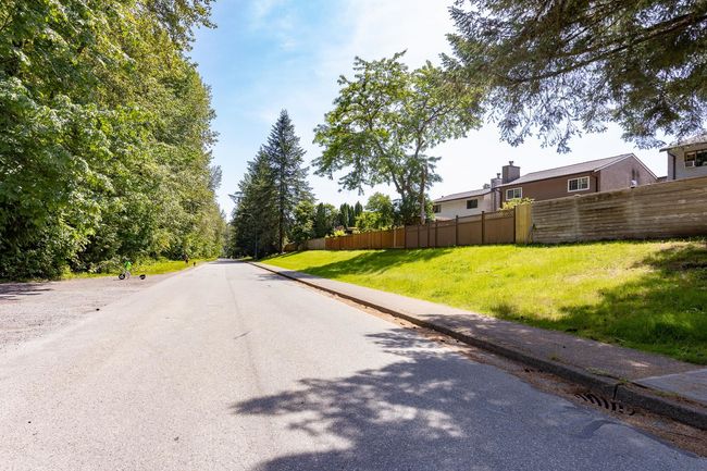 View of asphalt road featuring sidewalks | Image 27