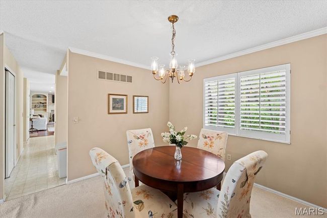 Dining room opens to the living room | Image 7
