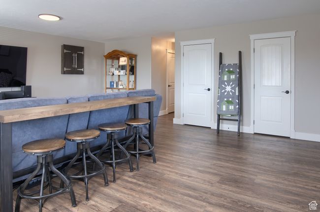 Great/Family Room with baseboards, wood finished floors. | Image 35