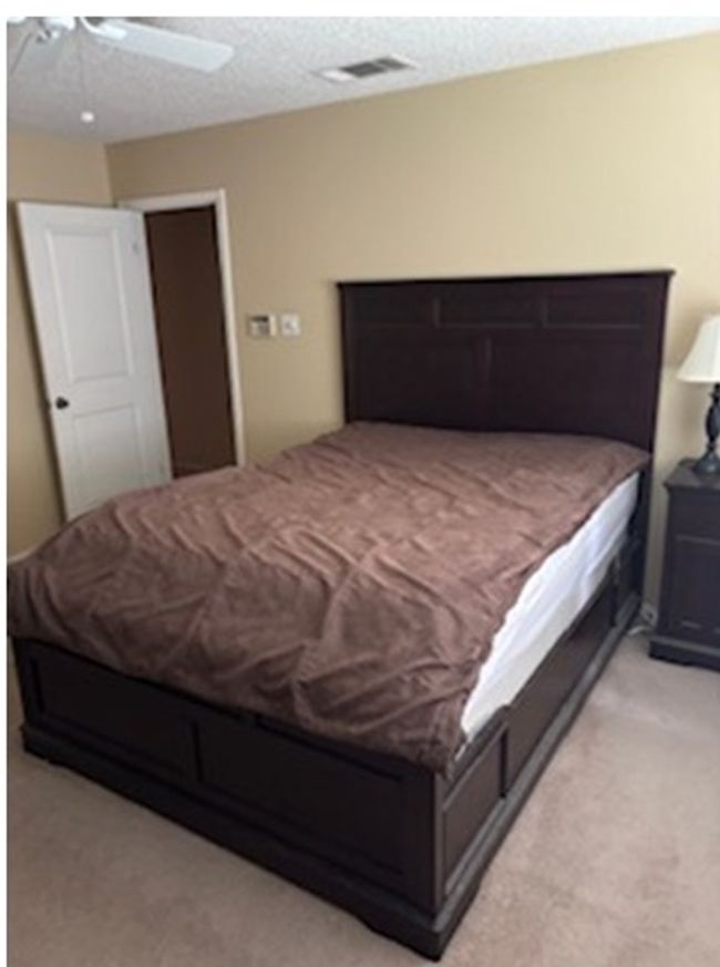 Bedroom with light carpet and ceiling fan | Image 4