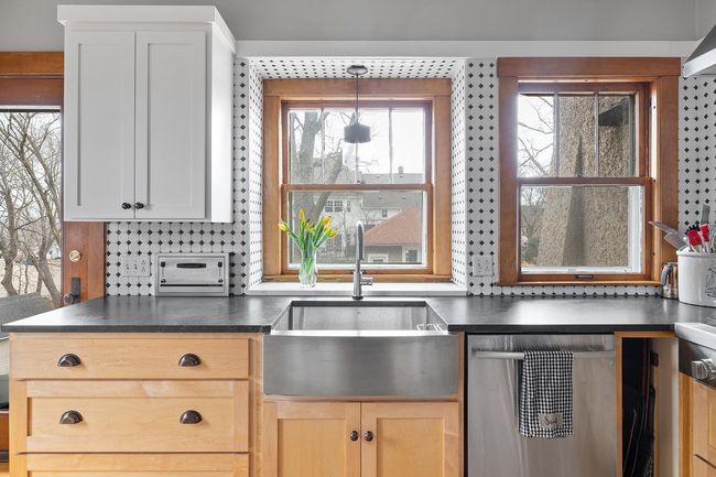 Recently remodeled, the kitchen has a tasteful mix of original details and newer more modern elements. | Image 23