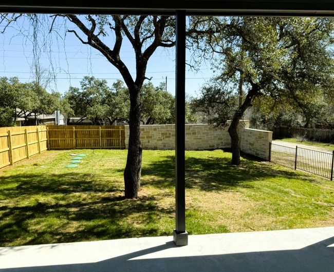 View of yard with a fenced backyard | Image 32