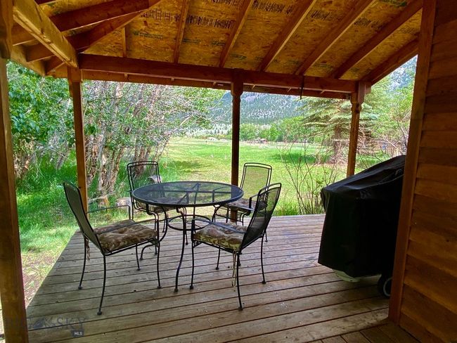 Grizzly Meadows Cottage Outdoor Sitting Porch | Image 34