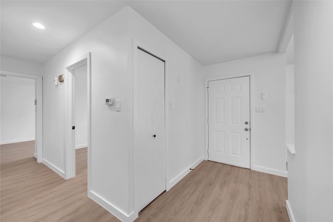 Entrance foyer with light wood finished floors, baseboards, and recessed lighting | Image 6