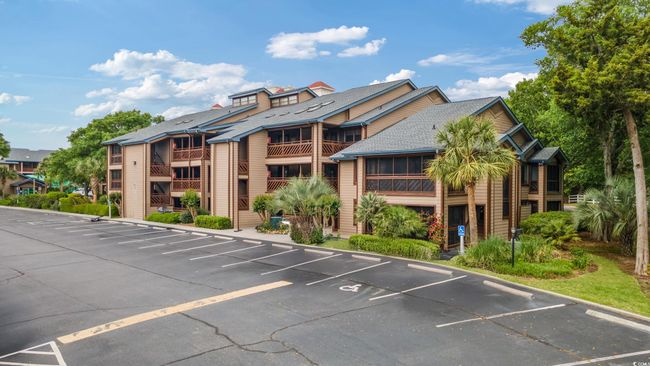 View of property featuring uncovered parking | Image 39