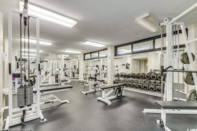 Workout area featuring a textured ceiling | Image 37