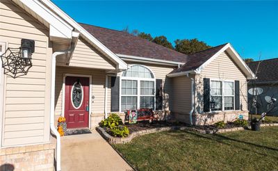 View of exterior entry with a yard | Image 2