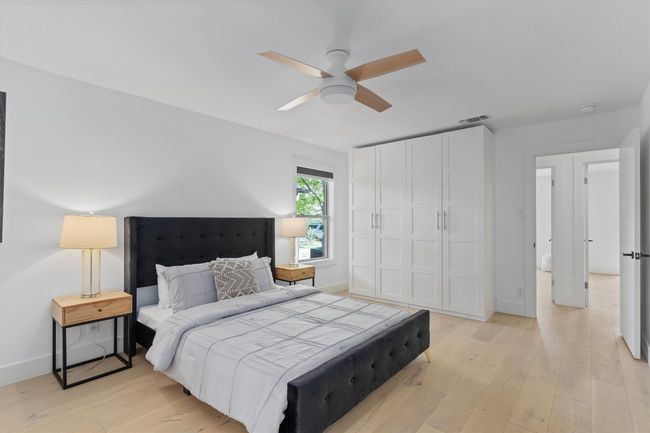This added wardrobe provides additional storage space. | Image 13