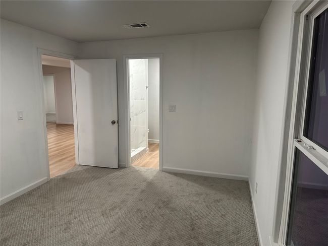 Empty room featuring visible vents, carpet flooring, and baseboards | Image 29