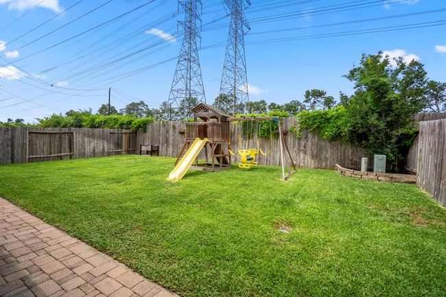 Gazing out into the backyard, enjoy the peaceful privacy of no rear neighbors—your own quiet retreat framed by a lush, open lawn. | Image 33