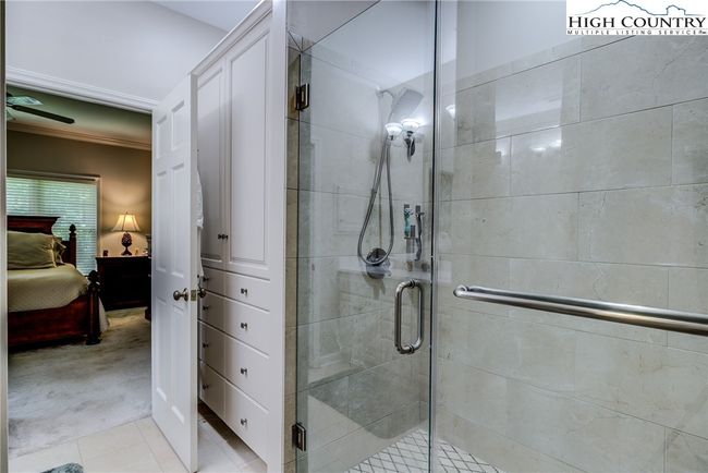 Updated walk in shower & custom built- in cabinetry. | Image 24