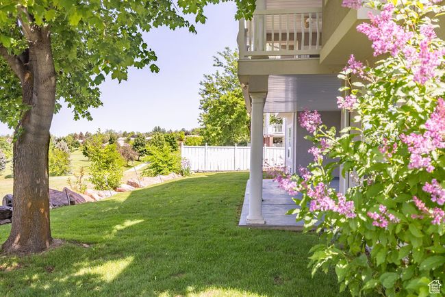 View of yard featuring a balcony | Image 37