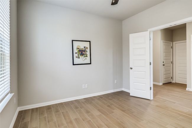 Unfurnished bedroom featuring light wood-type flooring and baseboards | Image 19