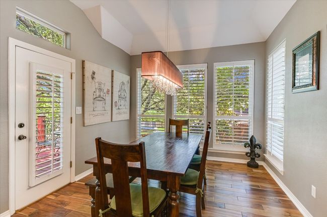 Dining area with lofted ceiling and plenty of natural light | Image 13