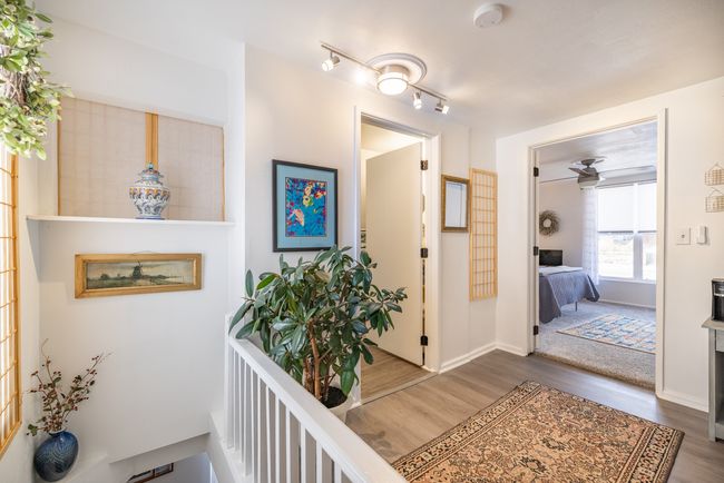 Hallway featuring wood finished floors and baseboards | Image 18