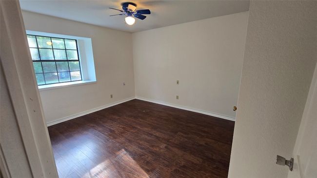 Empty room featuring wood finished floors and ceiling fan | Image 21