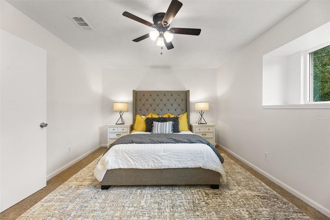 Primary bedroom with a private, serene atmosphere. | Image 14