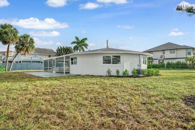 Back of house showing Screened Lanai - Virtually edited | Image 29
