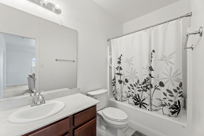 Full bath featuring shower / bath combo with toilet, and vanity | Image 34