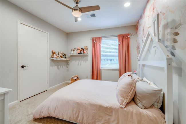 Bedroom 2 with with closet, carpet, ceiling fan, 2 inch blinds | Image 23
