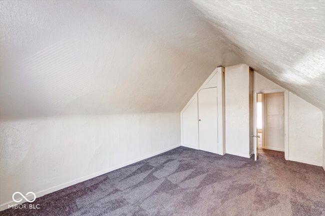 additional living space with baseboards, carpet floors, and lofted ceiling | Image 20