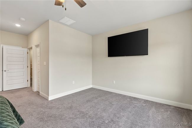Unfurnished bedroom featuring carpet flooring and ceiling fan | Image 39