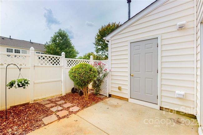 Fenced patio with storage | Image 22