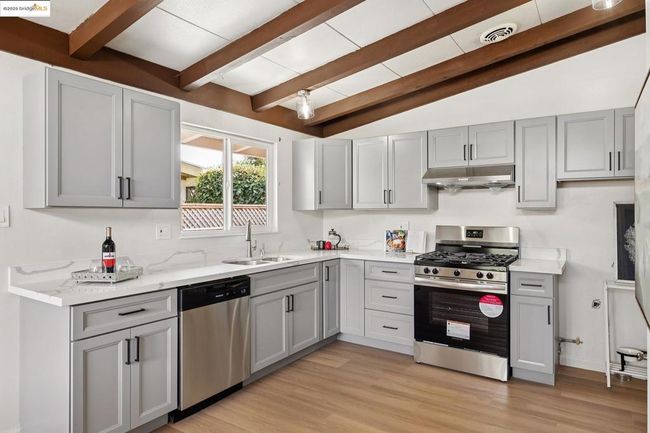 Stylish kitchen with sleek gray cabinetry | Image 14