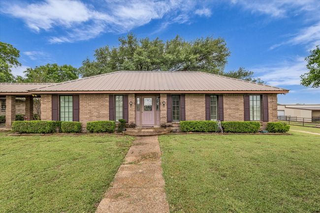 Single story home featuring brick siding and a metal roof | Image 17