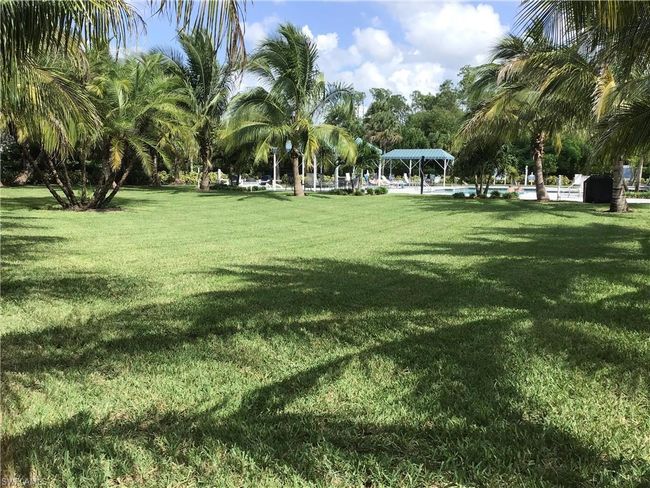 Pool area with open space | Image 23