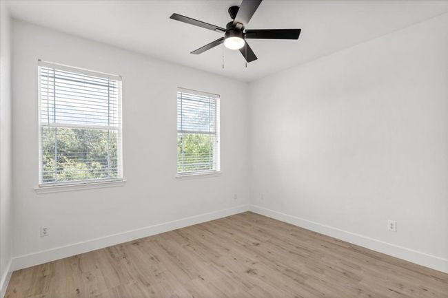 Empty room featuring light wood finished floors and ceiling fan | Image 22