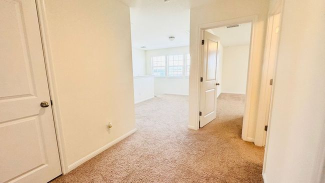 Hall featuring light carpet | Image 28