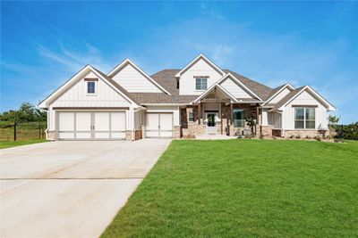 Craftsman-style home featuring a garage and a front lawn | Image 2