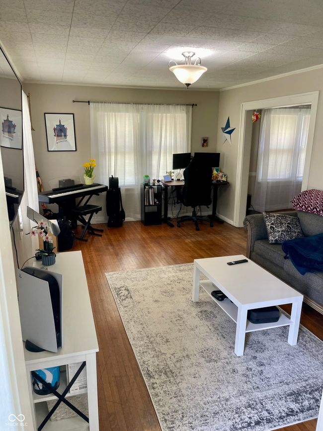 living area with wood finished floors | Image 5
