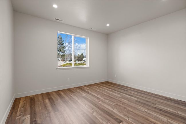 Unfurnished room featuring visible vents, recessed lighting, baseboards, and wood finished floors | Image 14