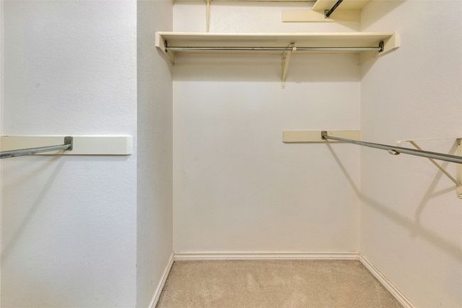 Spacious closet with carpet | Image 15