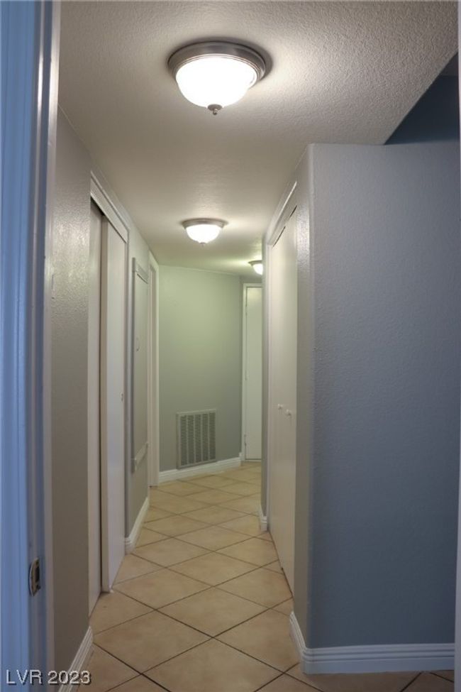 Laundry room and large linen closet in hallway | Image 24