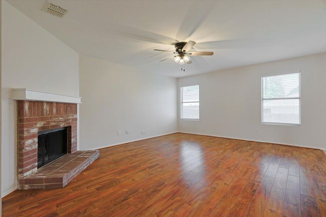 Living room with natural lighting from windows | Image 11