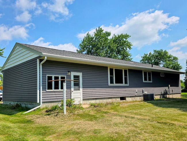 Back of house- white door is access to garage | Image 35