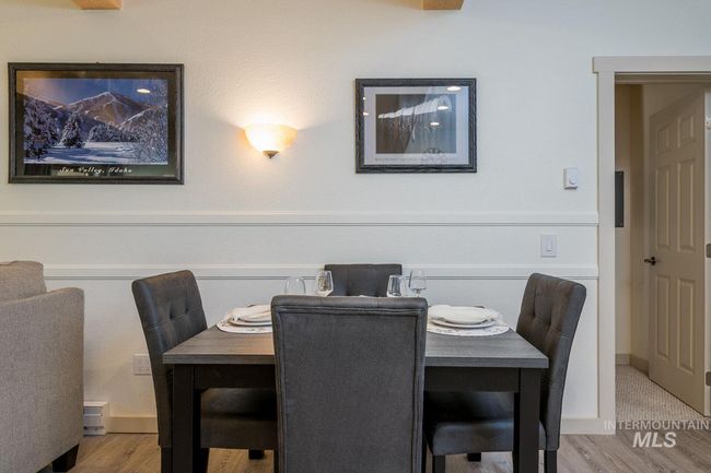 Dining space with wood finished floors | Image 6