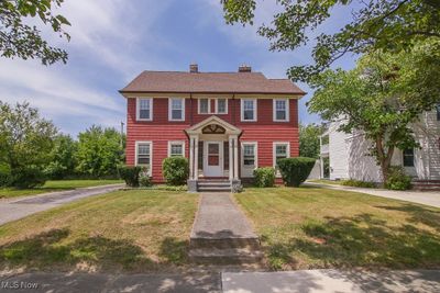 Colonial-style house with a front yard | Image 1