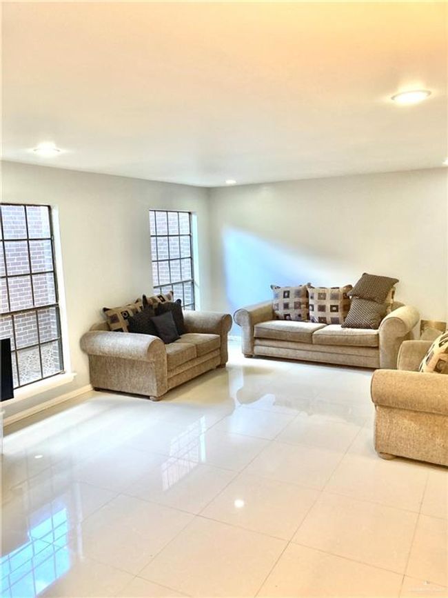 Living room featuring tile patterned floors and recessed lighting | Image 12