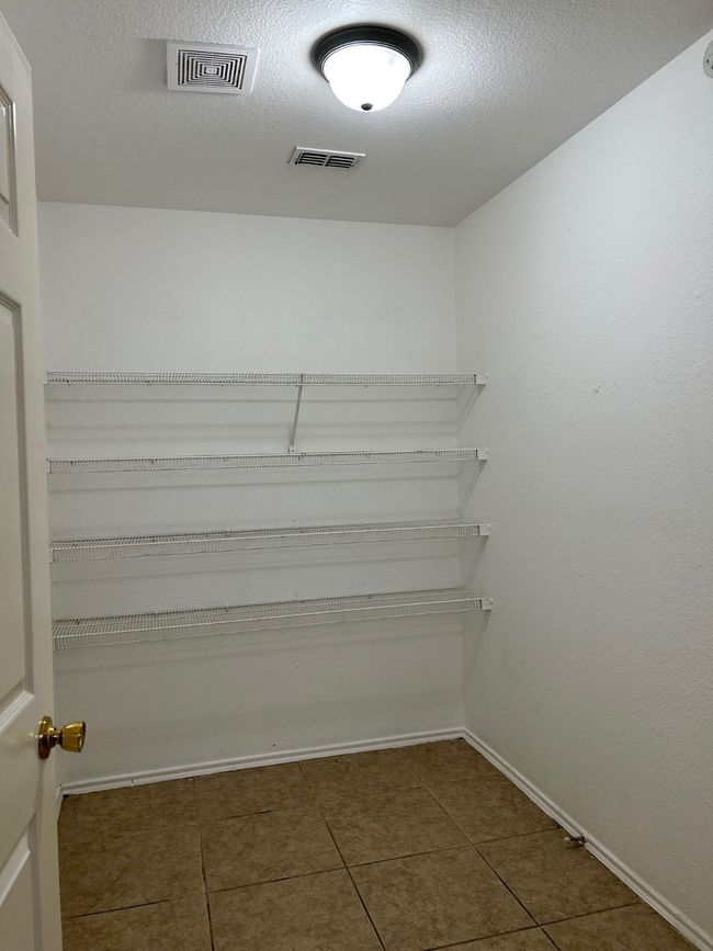 Storage room with visible vents | Image 20