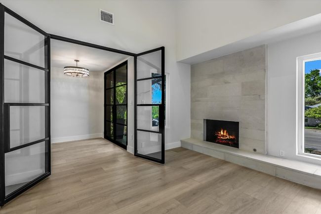 Office or fourth bedroom with fireplace, walk-in closet and wrought iron doors. | Image 8