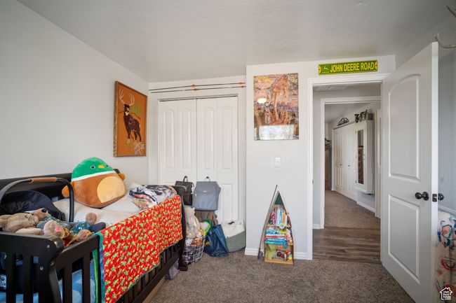 Carpeted bedroom featuring a closet and baseboards | Image 11