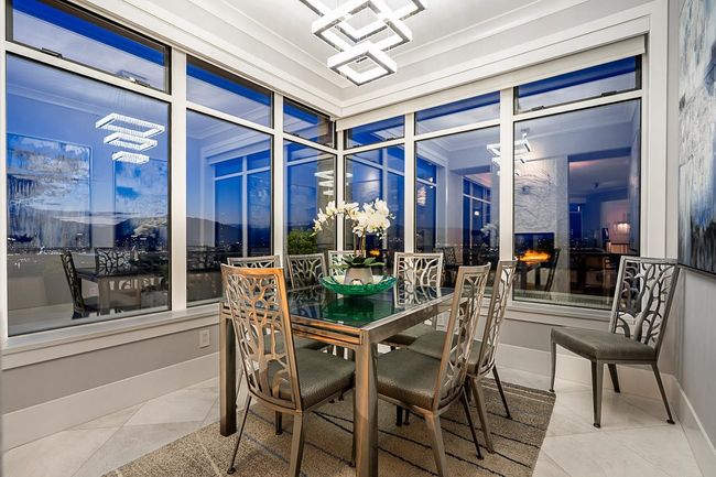 Sunroom featuring a chandelier | Image 18
