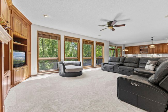 Large wall of windows over looking back yard and letting in so much light | Image 13