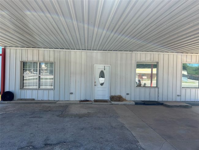 View of exterior entry featuring board and batten siding | Image 5