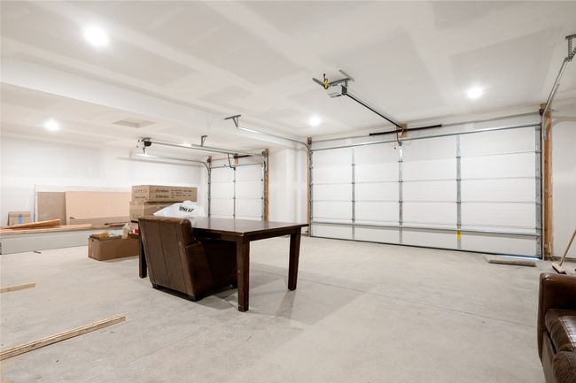 Garage with a garage door opener and recessed lighting | Image 45