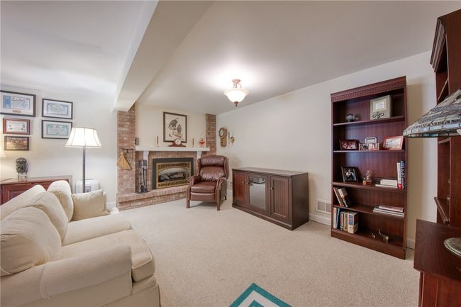 Game room with newer carpet and access to backyard | Image 31